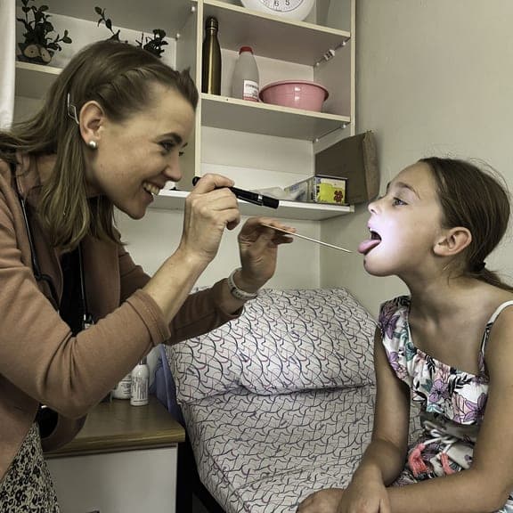 Dr. Rockhill examining a young patient
